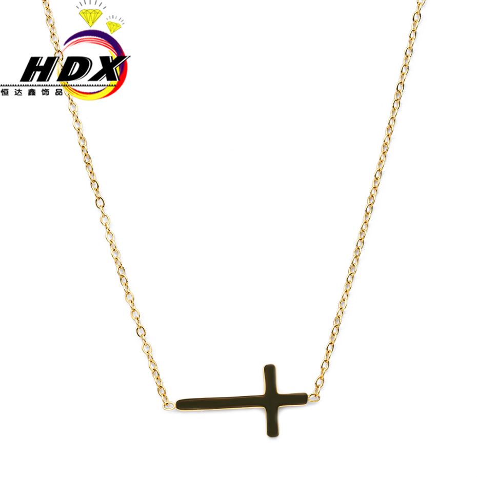 Religious belief the cross is a small gold female necklace